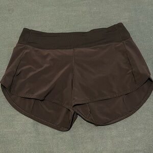 Black Lululemon Speed Up short, size 8, 4” length, mid rise